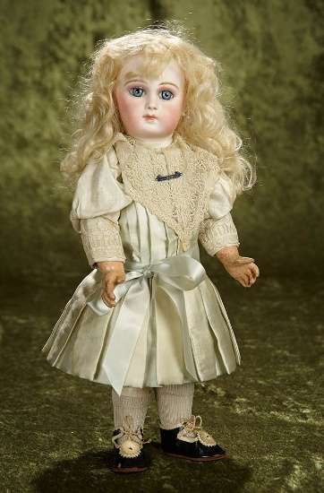 15" Very beautiful French bisque portrait bebe by Jumeau with original boutique label. $2800/3300