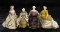 Four German Bisque Miniature Dolls with Sculpted hair and Original Ball Gowns 900/1400