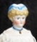 German Bisque Lady Doll with Sculpted Blue Cap and Ruffled Collar 600/900