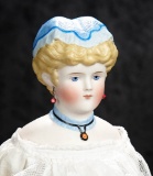 German Bisque Lady Doll with Sculpted Blue Cap and Ruffled Collar 600/900