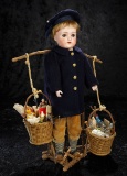 Wonderful German Bisque Toy Peddler as Candy Container with Baskets of Toys 2500/3500