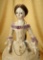 Fine Early English Wooden Lady Doll with Superb Early Costume and Accessories 27,000/35,000