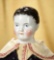 German Porcelain Doll Depicting Young Lad with Sculpted Short Curly Hair 400/600