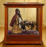 Early German Paper Mache Peddler Doll with Cart of Wares in Presentation Cabinet 1100/1500