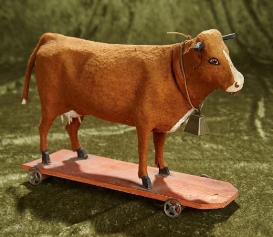 11" German pull toy cow with "Moo-o-" bellows, on wooden base. $200/400