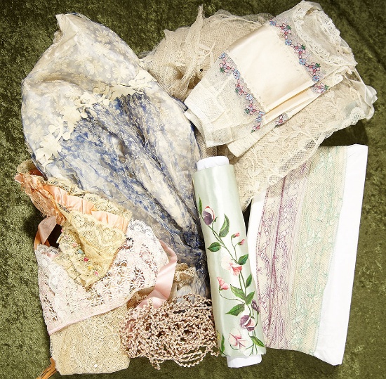 Lot of various antique fabrics, laces, and trims for doll costumes, two lace caps. $200/400