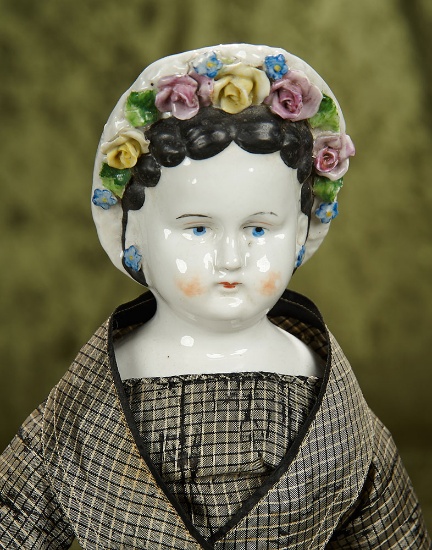 20" German porcelain lady doll with sculpted bonnet decorated with Dresden flowers. $400/600