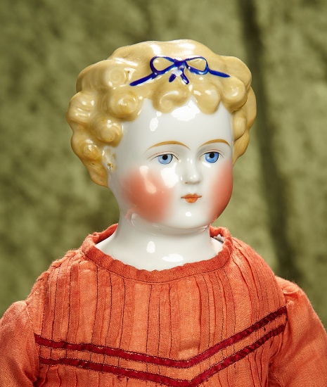 24" German porcelain lady doll with blonde sculpted curly hair with blue hair band. $400/500
