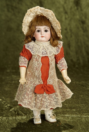 12" German bisque closed mouth doll, model 128, by Kestner. $1200/1600