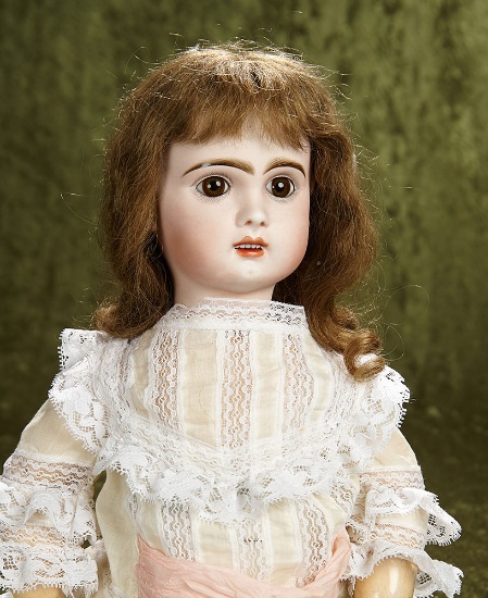 24" French bisque bebe by Jumeau/SFBJ with lovely brown glass paperweight eyes. $1100/1300