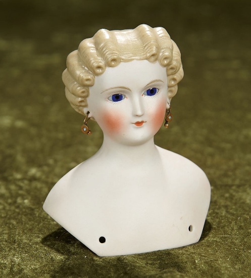 5" German bisque shoulderhead with light brown sculpted hair and blue glass cobalt eyes. $700/900