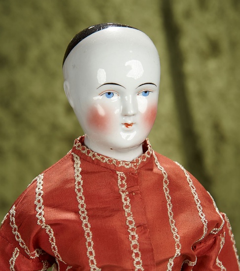 21" German porcelain doll with solid pate, antique costume and body. $500/750