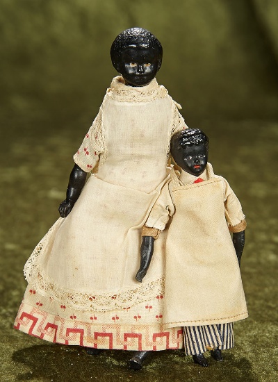 4"-7" Two German black bisque dollhouse dolls in original costumes. $400/500