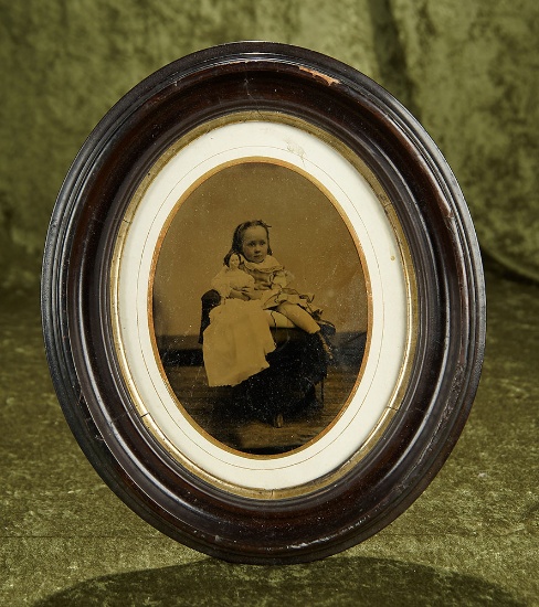 13" Framed, Rare size of vintage photograph depicting Annie holding doll, original frame. $300/500