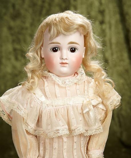 18" German bisque closed mouth child by Kestner, original body, body finish and wig. $1100/1500