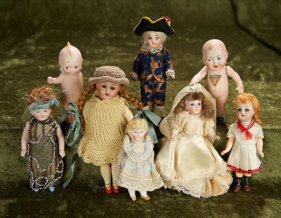 4 1/2" - 6 1/2" Eight German miniature bisque dolls. $400/500