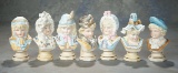 Set of Seven German Bisque Busts of Bonnet-Head Children by Hertwig 500/800