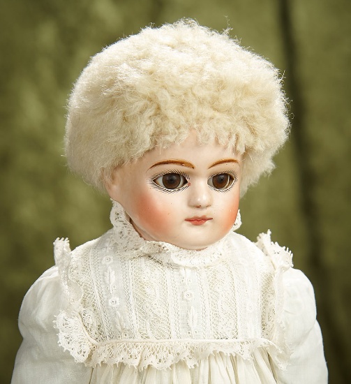13" German paper mache doll in fine original condition, antique costume. $400/500