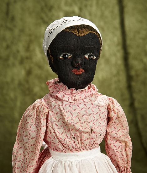 American black cloth folk doll in the Beecher manner with shoe-button eyes. $400/500