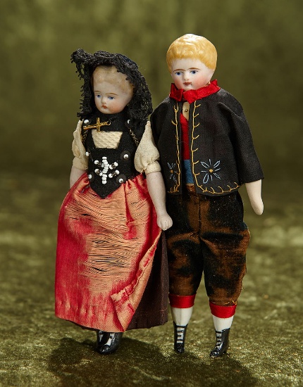 Pair, 6" Petite German bisque dolls with sculpted hair in original folklore costumes. $300/400