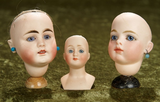 Three rare bisque doll heads including Bru Jne 1. $400/600