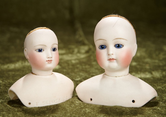 Two French bisque poupee heads by Blampoix with cobalt blue eyes. $1200/1600