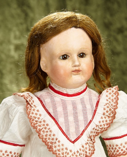23" Rare early French paper mache bebe by Schmitt et Fils with eight-ball-jointed body. $1400/1800