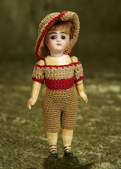 5" German bisque miniature doll with closed mouth and original knit costume. $300/400