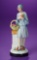 German Porcelain Flapper Lady with Basket of Flowers 150/250