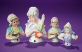 Four German Porcelain Half-Dolls in Dutch Caps 400/500