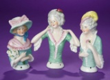 Trio of German Porcelain Half-Dolls with Well-Detailed Costumes and Accessories 200/400