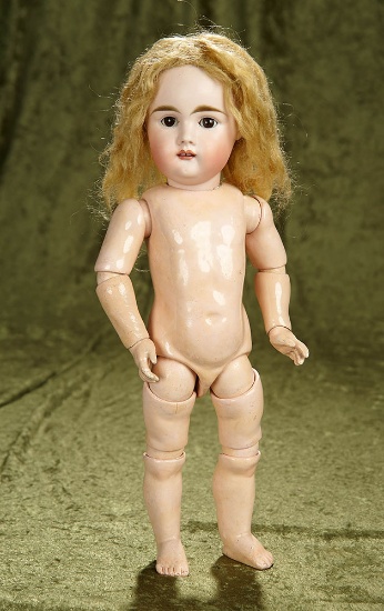 16" German bisque child with square-cut teeth, early eight-loose-ball-jointed body. $800/1000
