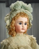 French Bisque Bebe Steiner for Au Nain Bleu, Original Costume with Signed Bonnet  3500/5500
