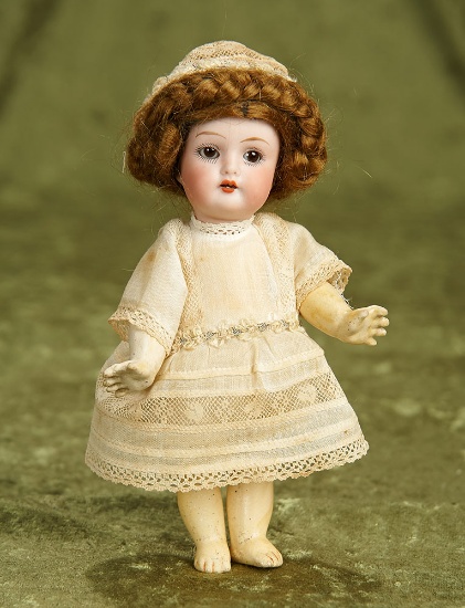 6 1/2" German bisque character, 126, by Kammer and Reinhardt, original toddler body. $300/400