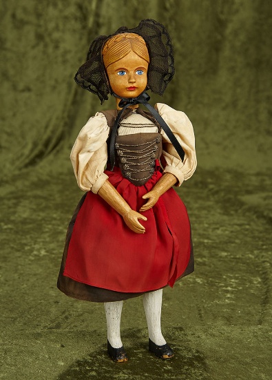 14" Swiss carved wooden doll by Huggler with carved coronet, original costume. $400/500