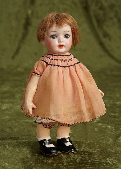 9" German bisque character "Hanne" by Schoneau and Hoffmeister. $400/600