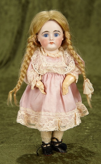 11" German bisque closed mouth doll by Kestner with original body and body finish. $1100/1300