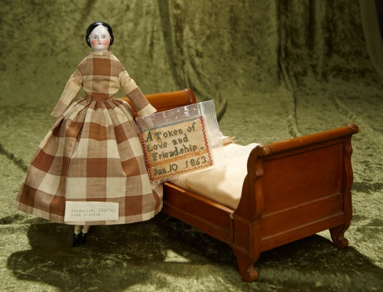 10" German porcelain doll, orig costume, wooden bed,1863 miniature woven needlework. $500/700