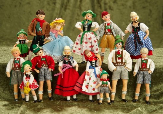 Thirteen 4"-5" German cloth character dolls by BAPS in Bavarian style costumes. $400/500