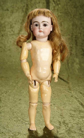 16" German bisque child, model 128, closed mouth by Kestner with original signed body. $800/1000