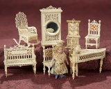 Collection of Tiny Carved Bone Miniature Furnishings and All-Bisque Doll 500/800