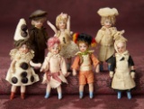 Seven French All-Bisque Mignonettes with Original Costumes 400/500