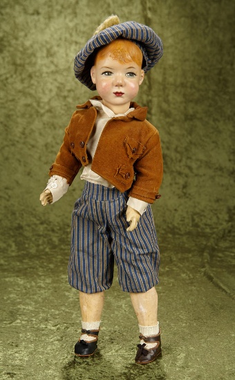 20" European paper mache/wood pulp boy with hand painted facial features on composition body.