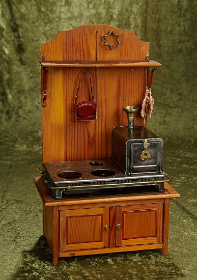 17"h. German metal stove, brass trim on original wooden cabinet, attributed to Maerklin. $400/500