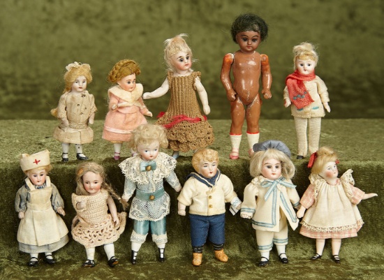 Eleven 3 1/2"- 4 1/2" German bisque miniature dolls. $500/600