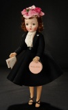 Cissy in Black Wool Suit with Flower Petal Hat, 1957 800/1000