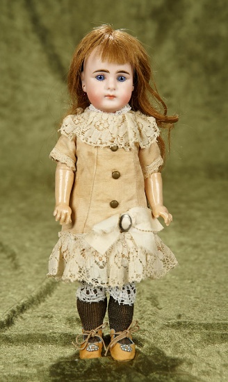 11" Sonneberg bisque doll, closed mouth, 32.22, Gebruder Kuhnlenz, original costume. $800/1100