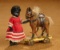 German All-Bisque Miniature Doll with Ebony Complexion, with Toy Horse 400/600