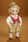 Delightful German All-Bisque Googly, Model 111, with Rare Multi-Jointed Limbs 1800/2400