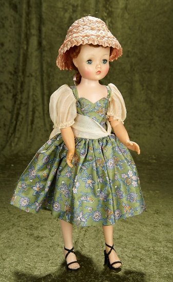 20" Vintage hard plastic Cissy with auburn hair in bird and flower dress with organdy sleeves.